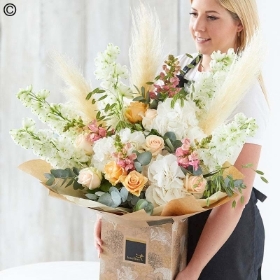 Lily free hand tied bouquet made with the finest flowers...